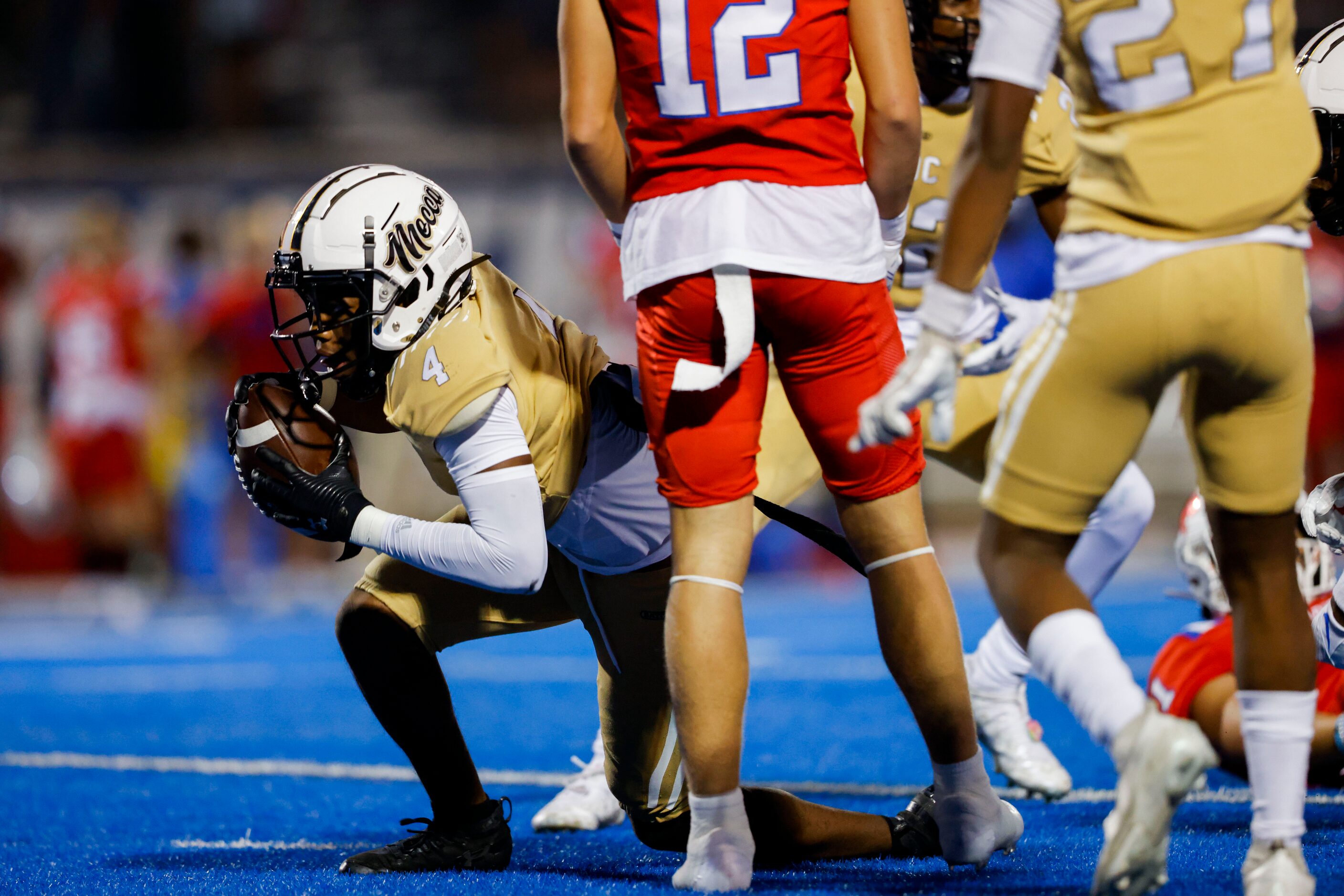 South Oak Cliff’s defensive back David Spruiells (4) gets up after intercepting a ball from...