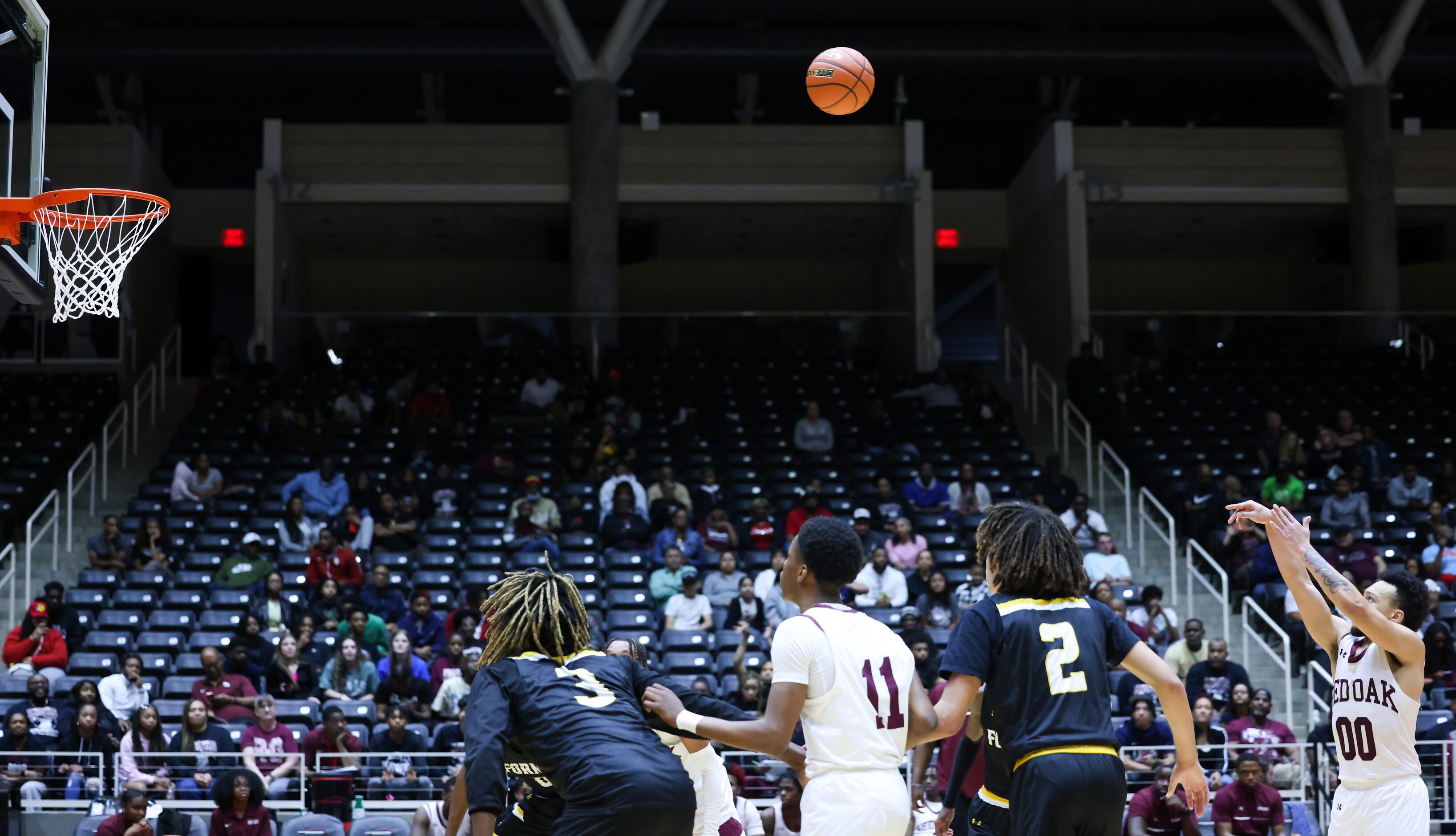 Red Oak senior guard Mark Broussard (00, right) makes a free throw shot during a Class 5A...