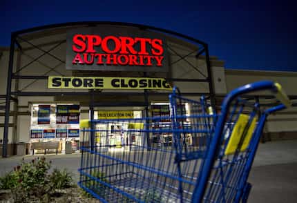 A shopping carts stands outside a Sports Authority store. (Daniel Acker/Bloomberg News)