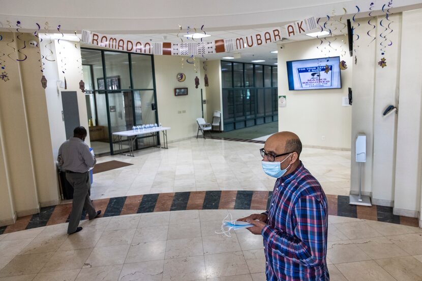 Community organizer Nordean Mebarek Nouiouat hands out masks to anyone who may need one...