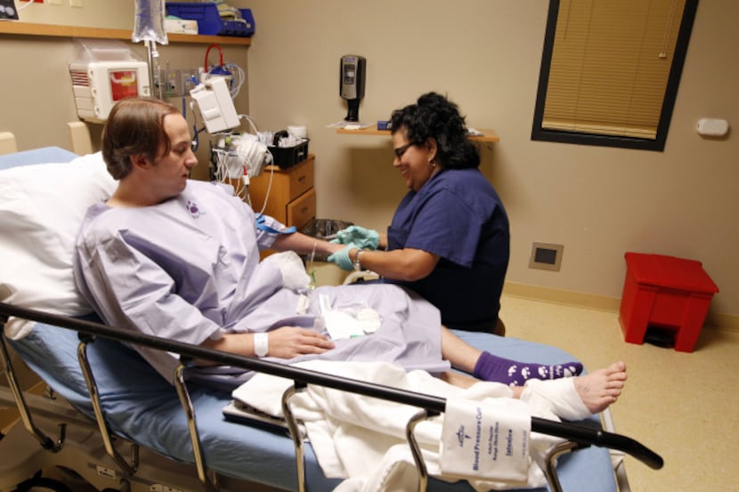 George Ten Eyck is prepped for surgery by Christine Varela, a registered nurse, at  Victory...