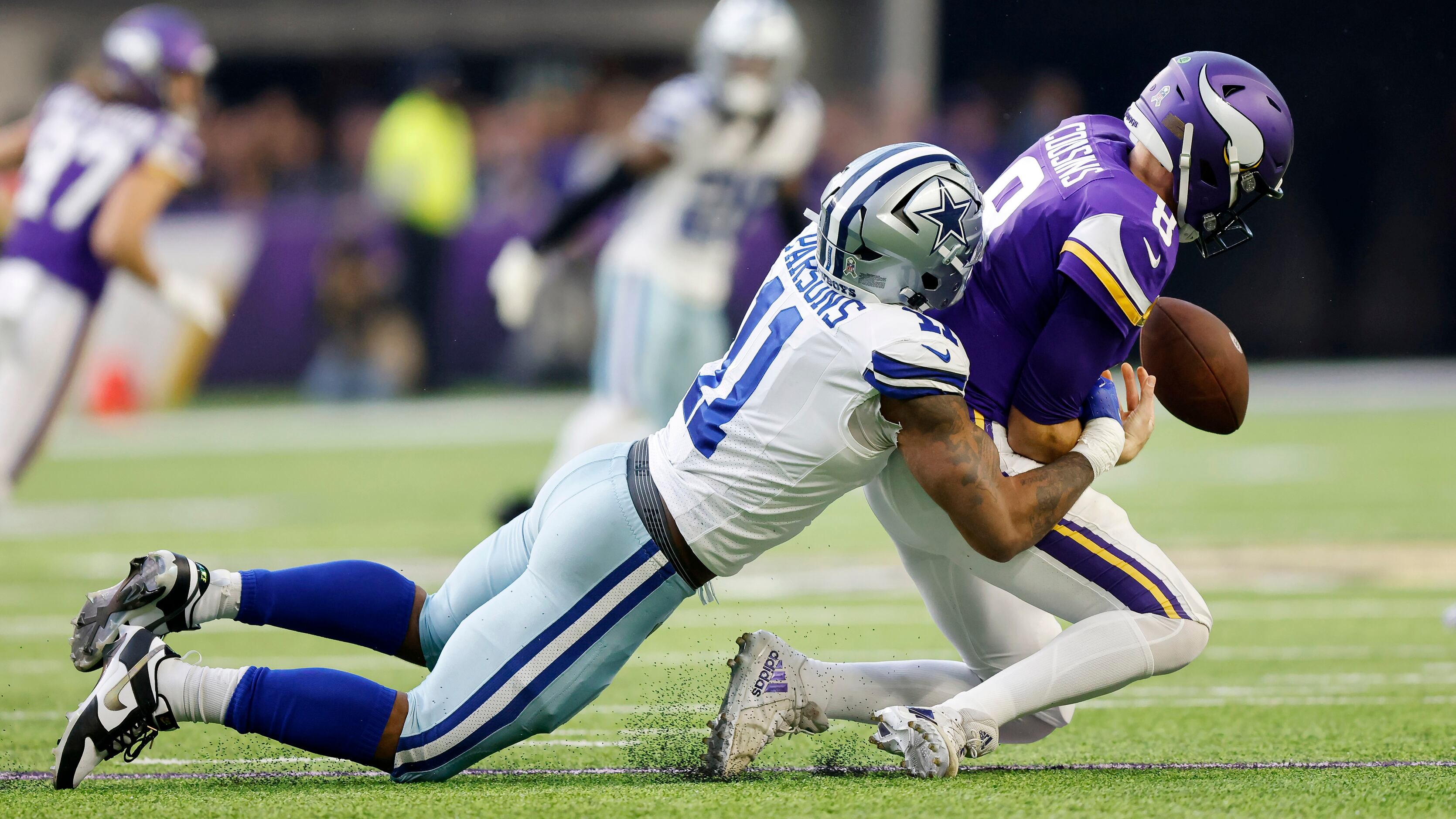 Minnesota Vikings running back Dalvin Cook (33) fumbles as he is hit by  Dallas Cowboys safety D …