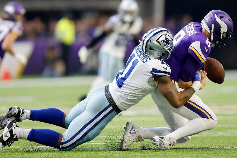 Dallas Cowboys linebacker Micah Parsons (11) forces Minnesota Vikings quarterback Kirk...