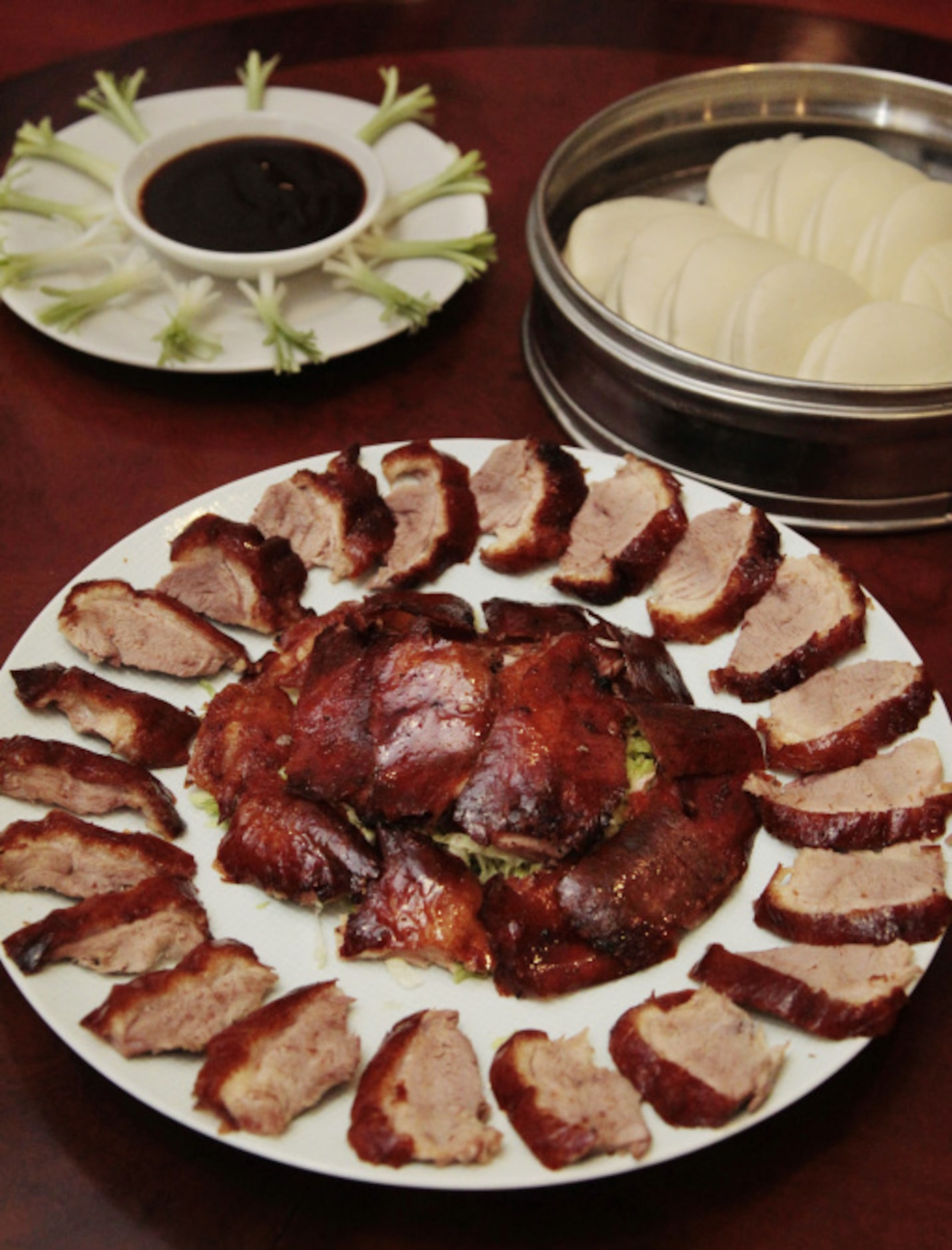 Peking duck with scallion garnish at J.S. Chen's Dimsum and BBQ