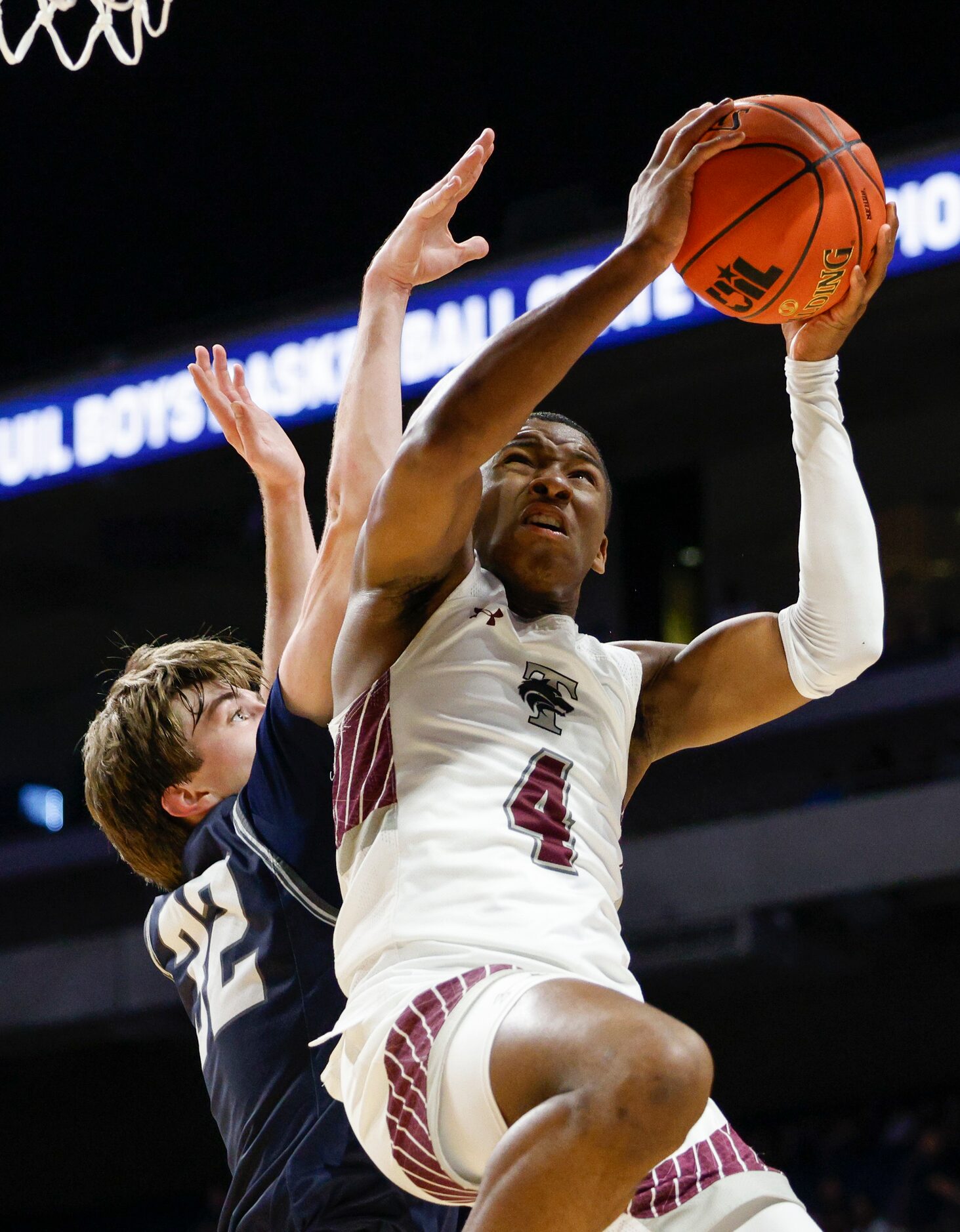 Mansfield Timberview guard Donovan O'Day (4) collides with Boerne Champion guard Owen Tate...