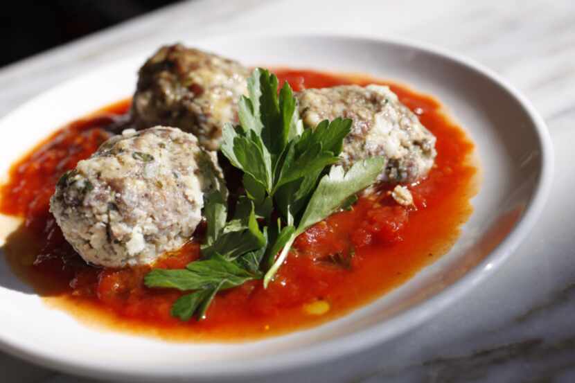 Keftedes -- lamb meatballs flecked with parsley and mint and rounded out with feta -- come...