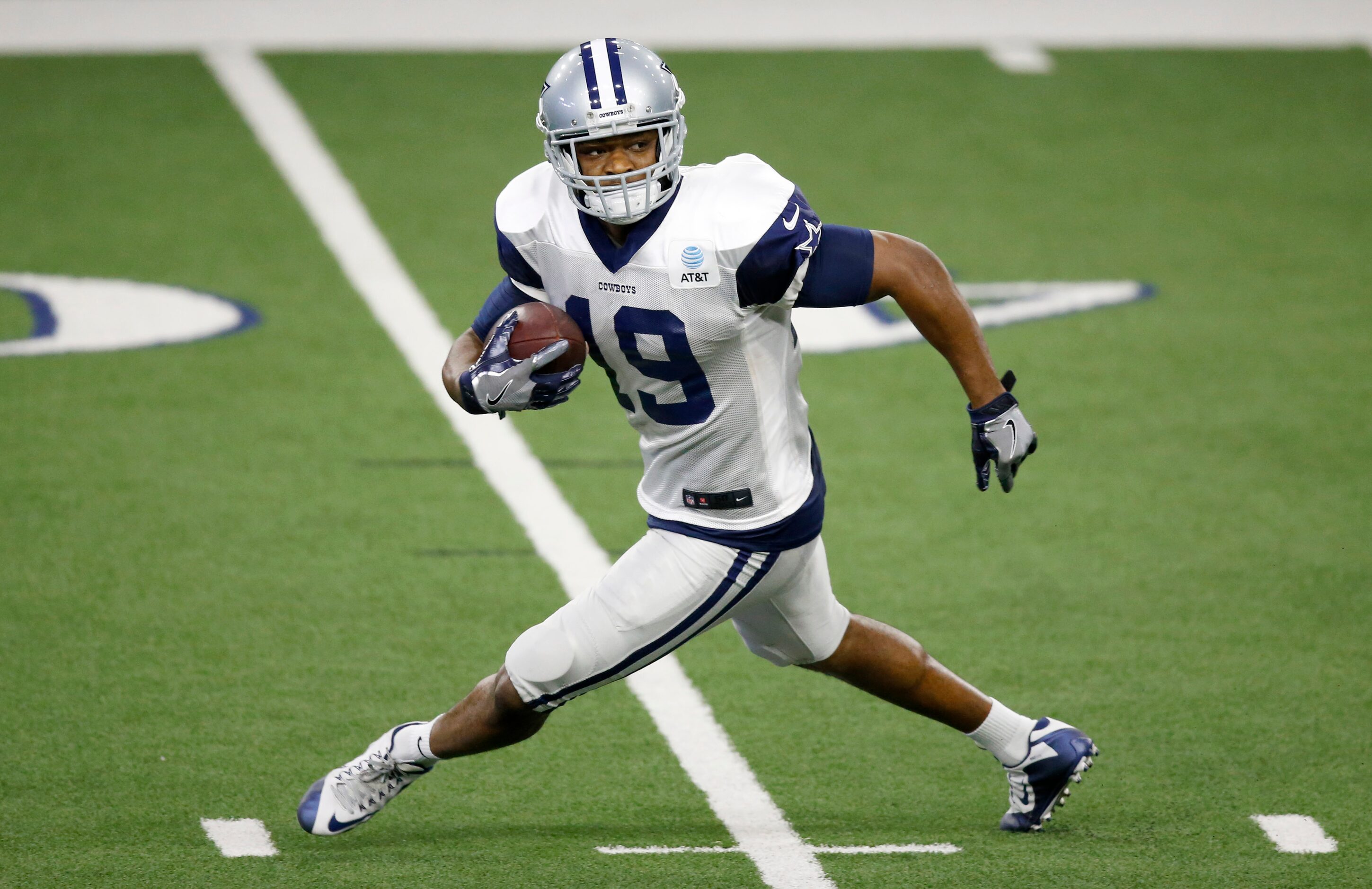 Dallas Cowboys wide receiver Amari Cooper (19) spins around on a pass attempt play in...