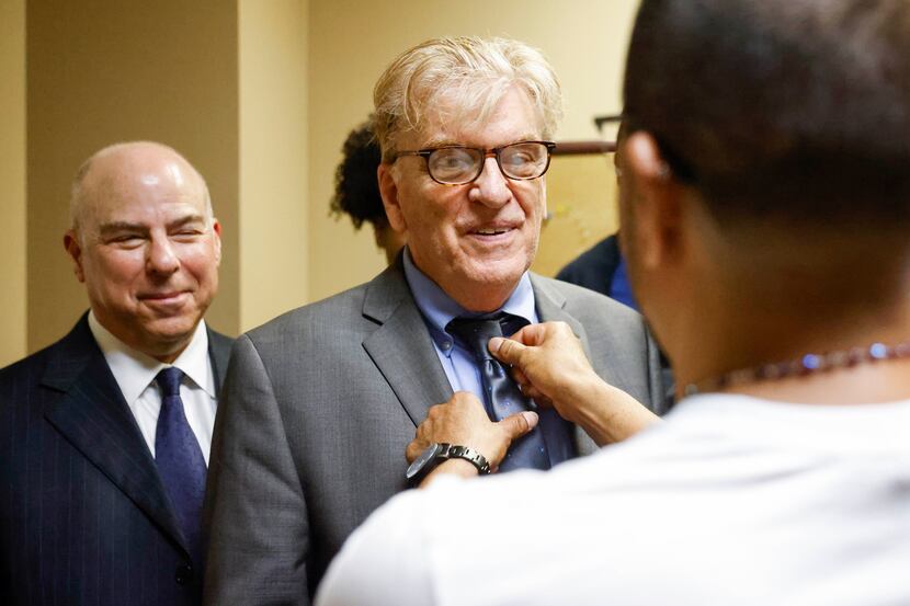Martin Santillan (right) adjusts the tie of his lawyer, Paul Casteleiro, legal director of...