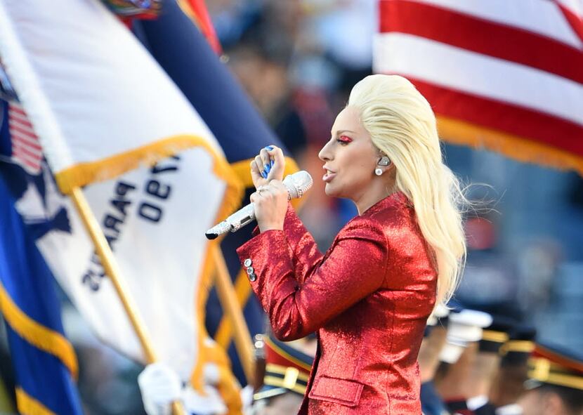 Lady Gaga performs the National Anthem sings the National Anthem prior to Super Bowl 50...