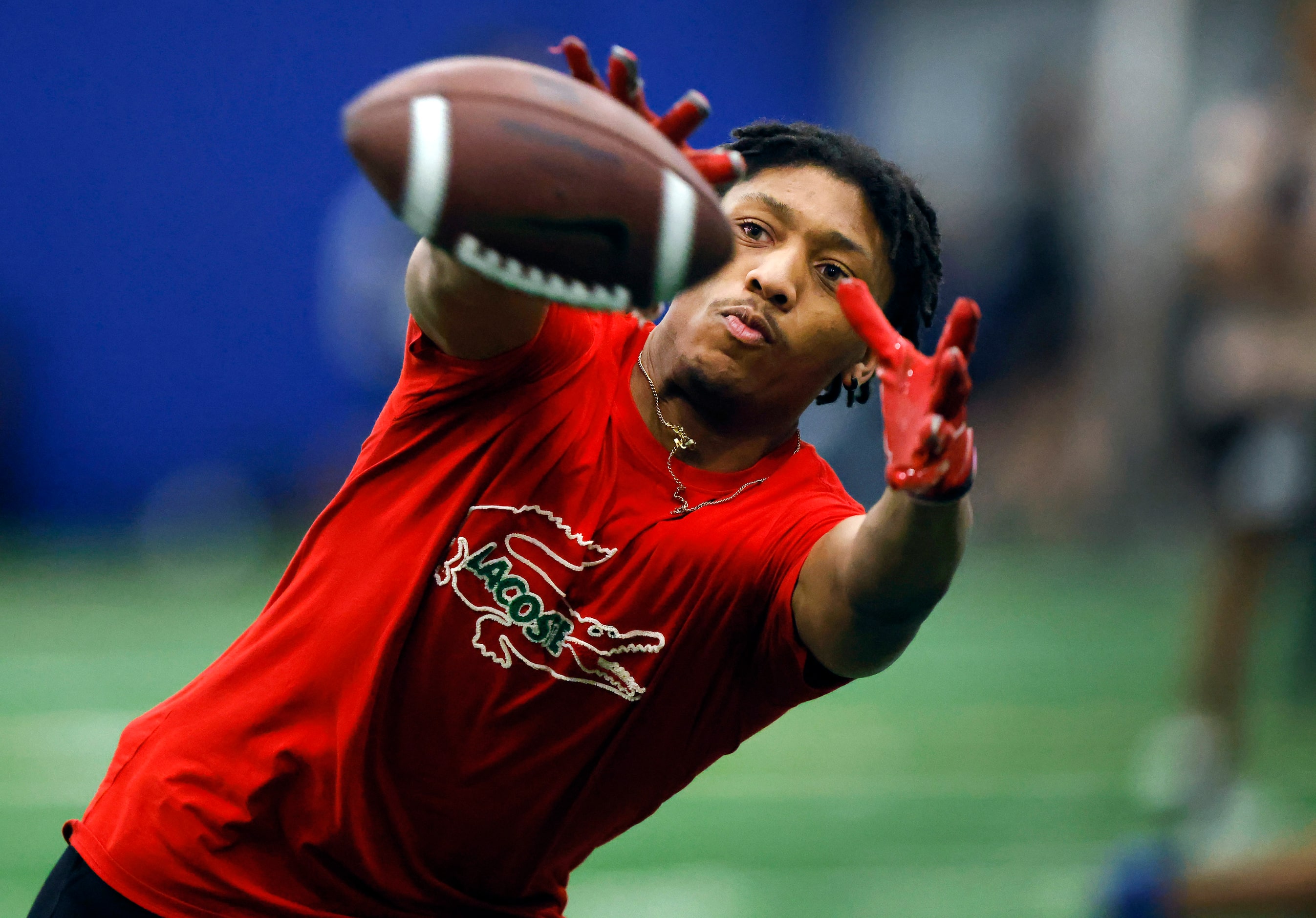 Unsigned senior wide receiver Nasir Allah of Trinity High School stretches for a pass...