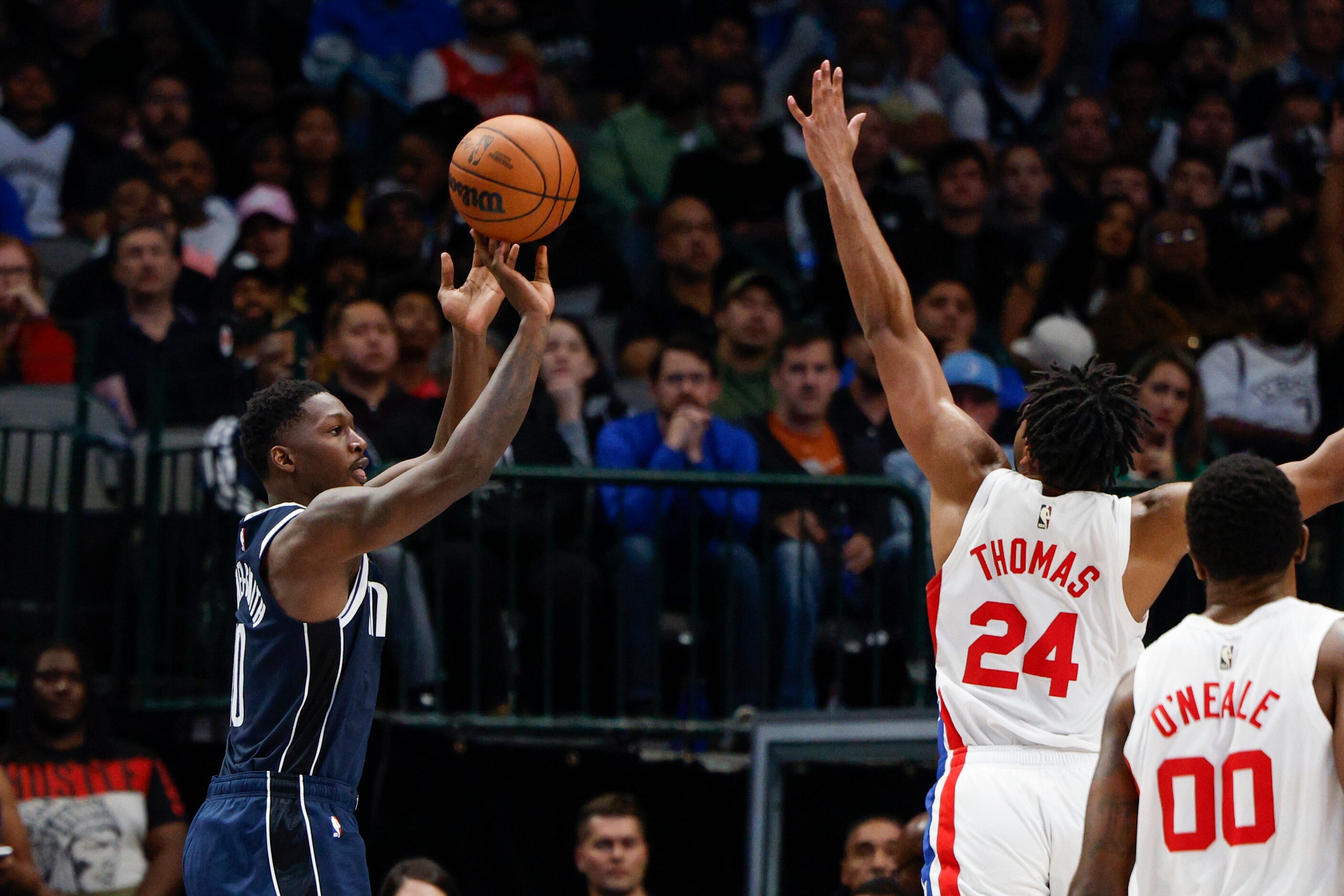 Dallas Mavericks forward Dorian Finney-Smith (10) shoots a three-point shot against Brooklyn...