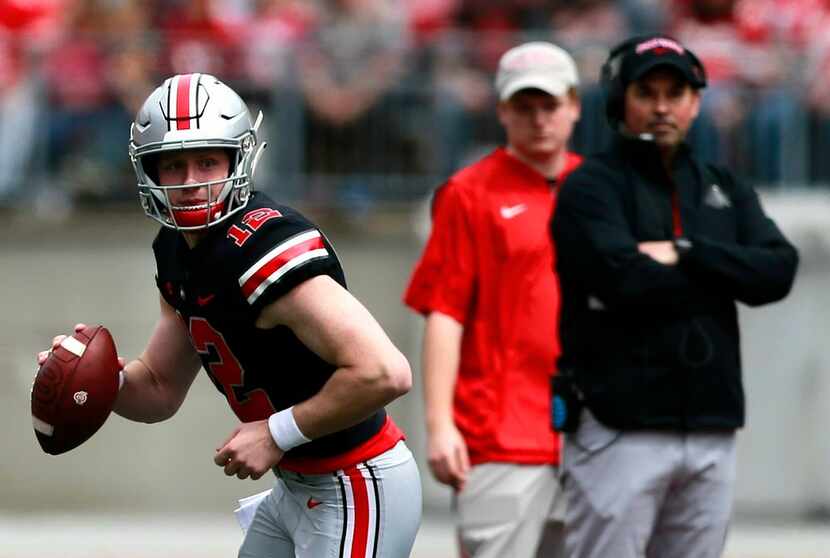 Ohio State's coach Ryan Day watches as quarterback Matthew Baldwin looks to pass during the...