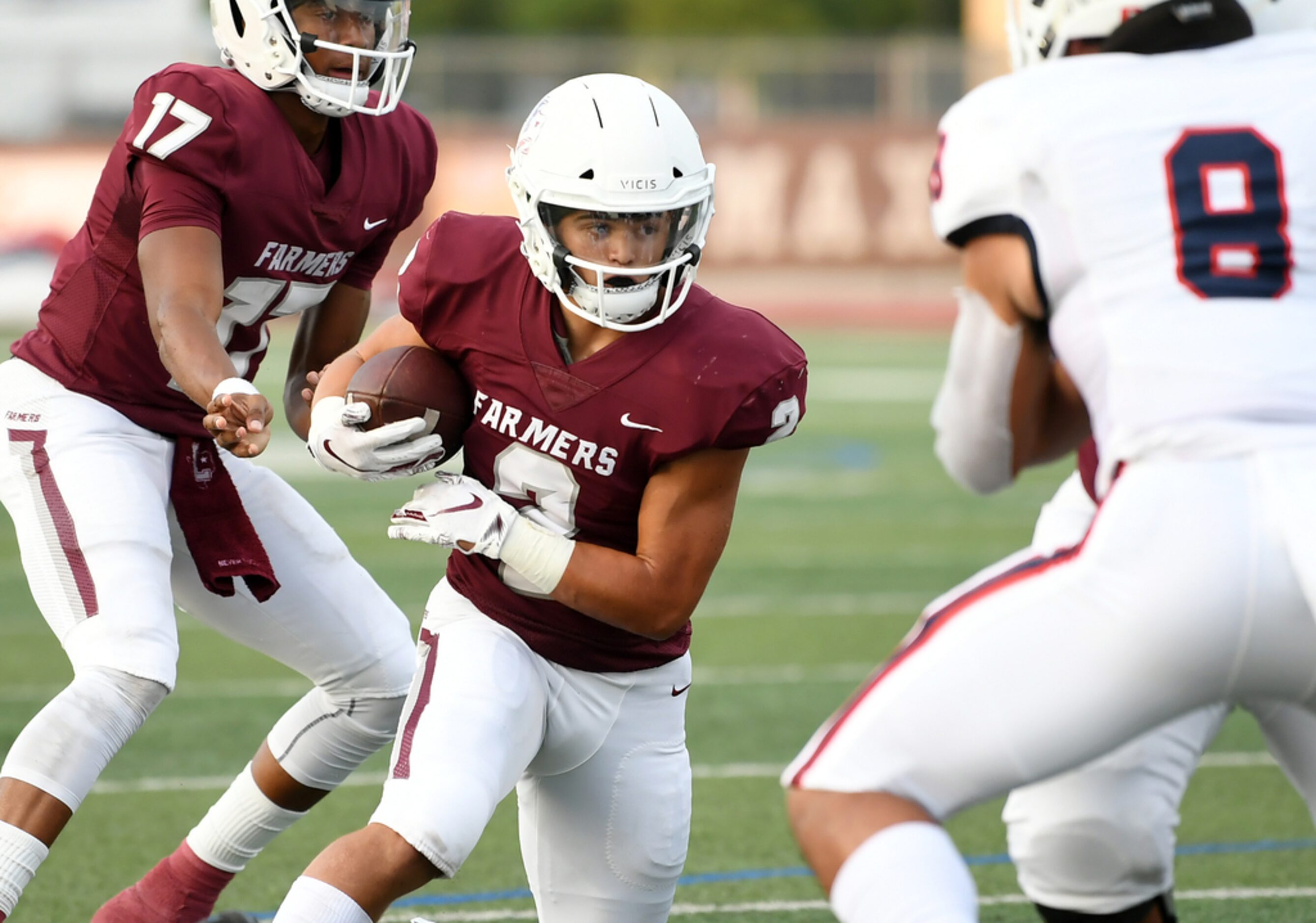 Lewisville senior running back Ben McAfee (2) cuts towards the goal line after taking the...