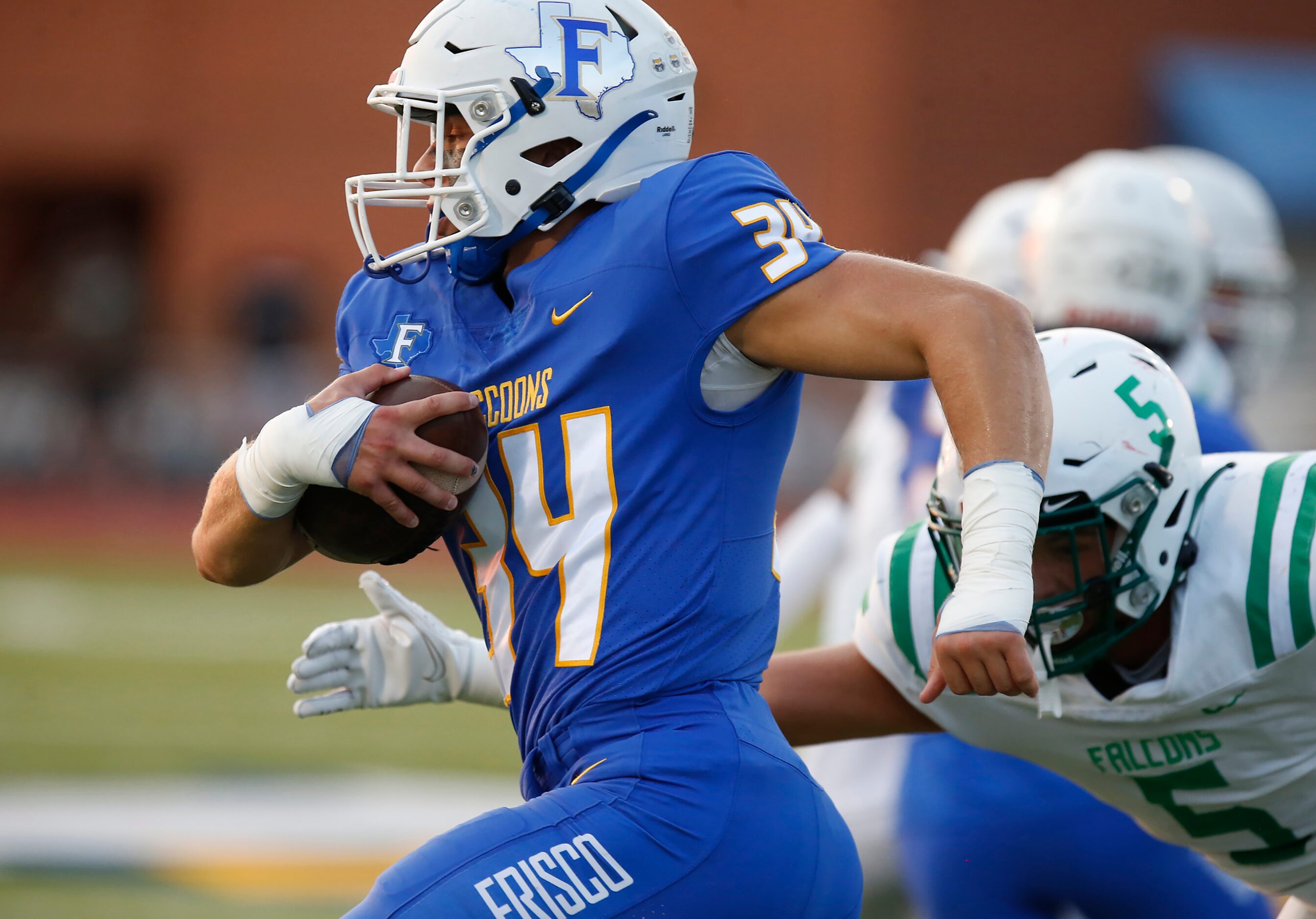 Frisco High School Aj Yasilli (34) outruns Lake Dallas High School defensive lineman Jesse...