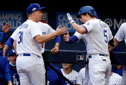 Los Angeles Dodgers shortstop Corey Seager (5)  is congratulated on his first inning solo...