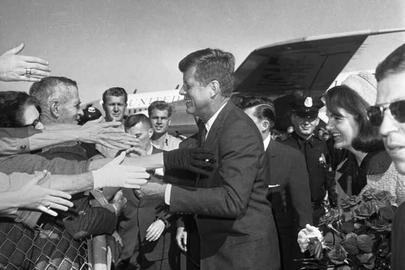 President John F. Kennedy and his wife, Jacqueline, arrive at Dallas Love Field on the...