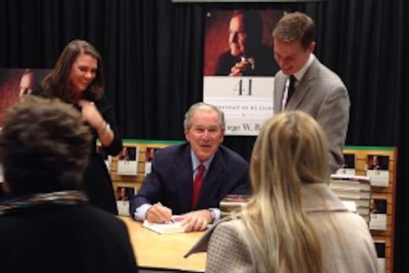  Former President George W. Bush signs copies of "41: A Portrait of My Father" Thursday...