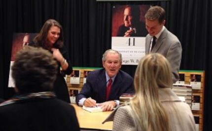  Former President George W. Bush signs copies of "41: A Portrait of My Father" Thursday...