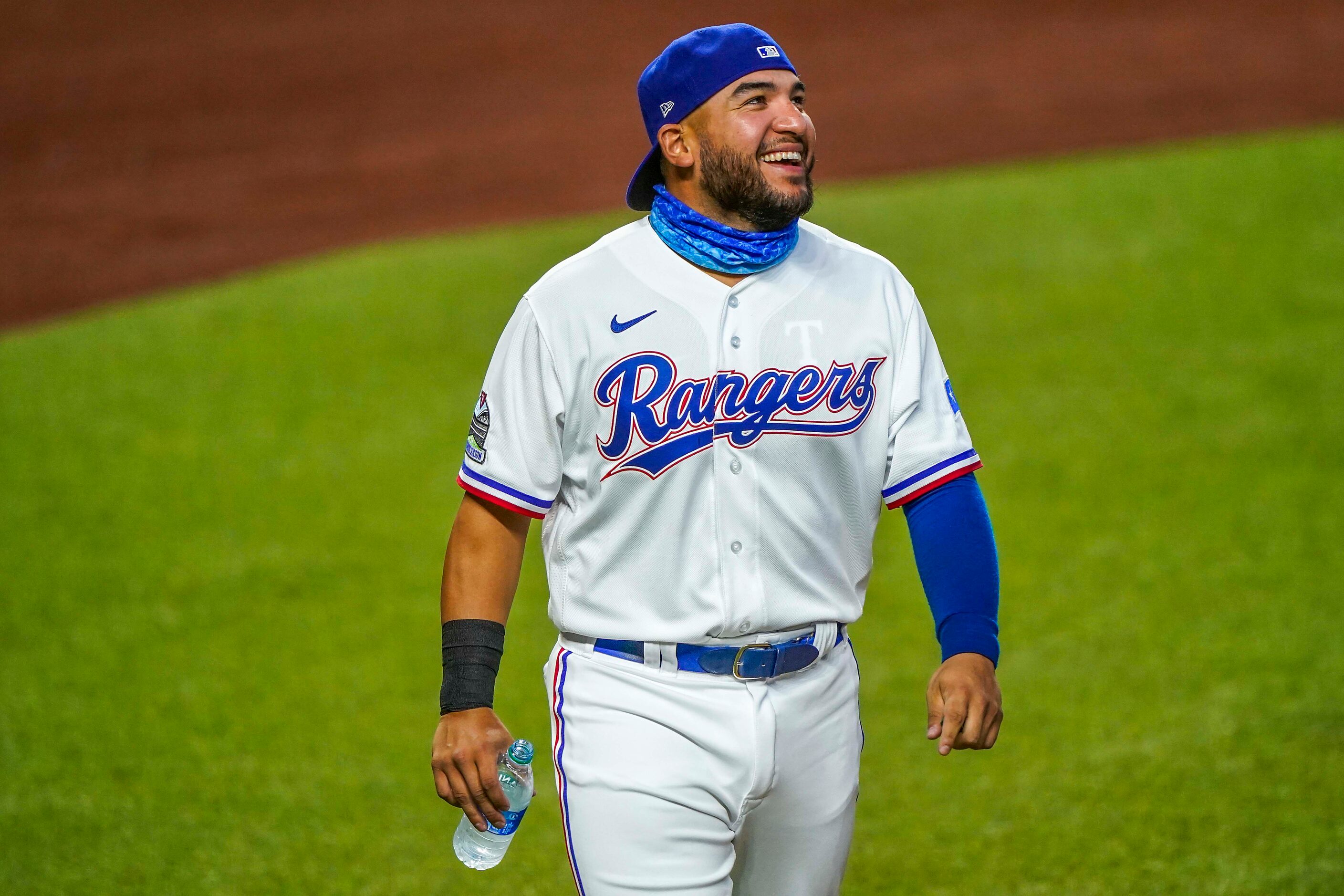 Catcher Jose Trevino laughs with teammates during Texas Rangers Summer Camp at Globe Life...