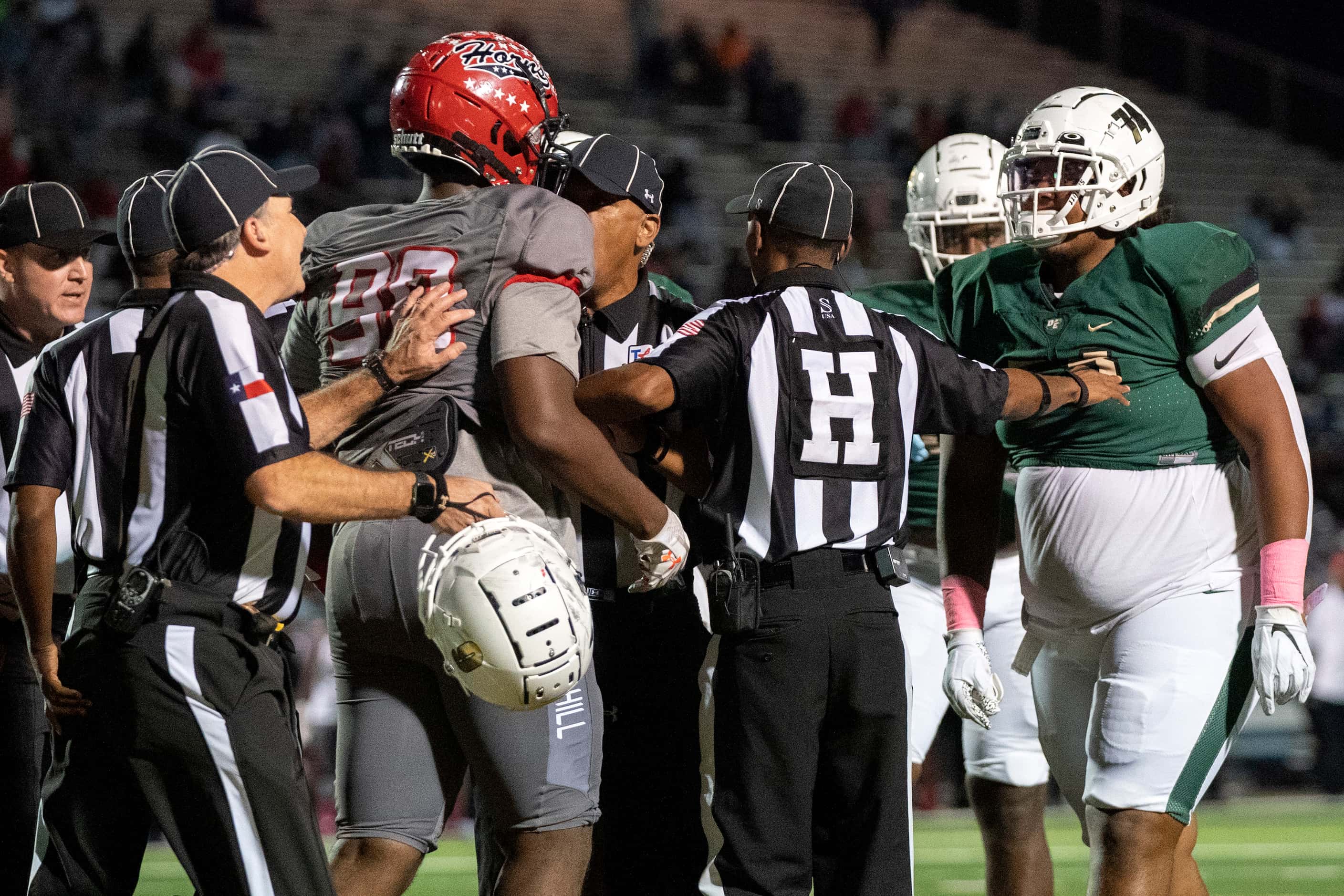 Referees step in to break up extra-curricular activity after the whistle between DeSoto and...