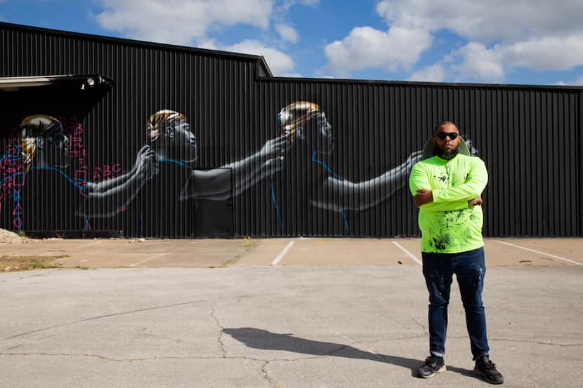 Jeremy Biggers' mural in Dallas' Wild West Mural Fest depicts how Black men can uplift each...