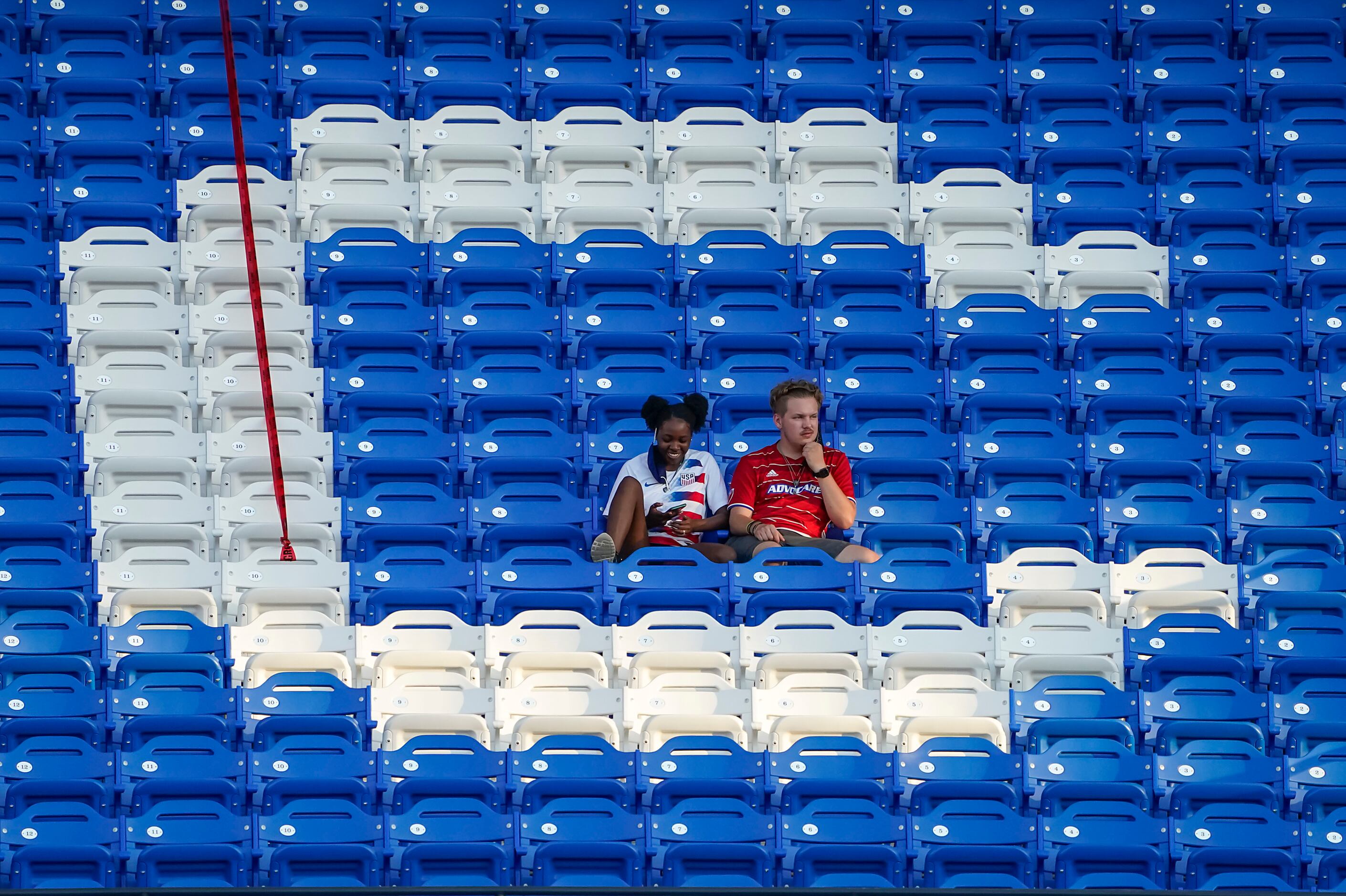 Fans sit in the middle of the ÔCÕ in FC Dallas during the first half of an MLS soccer game...