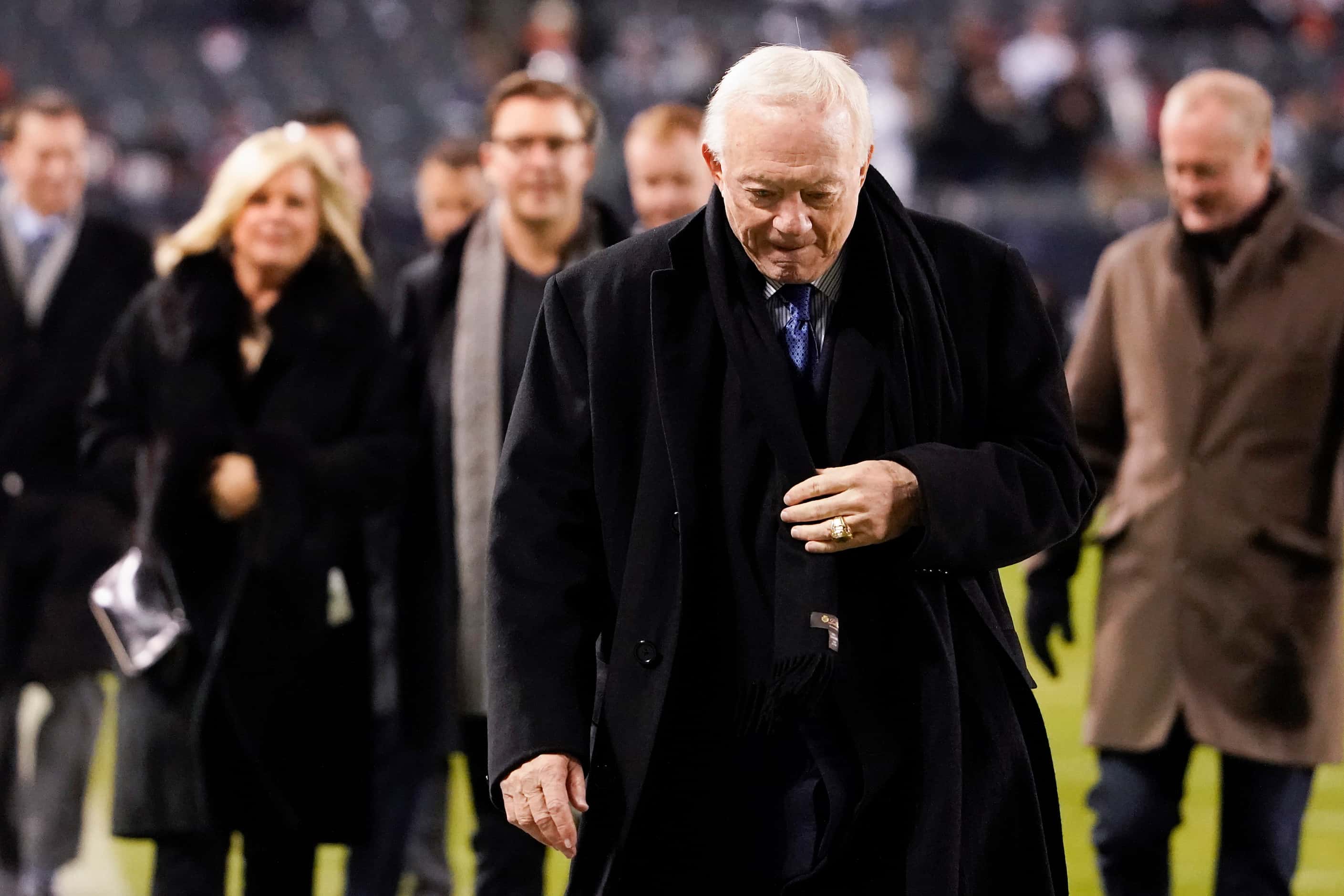 Dallas Cowboys owner Jerry Jones walks off the field after warmups before an NFL football...