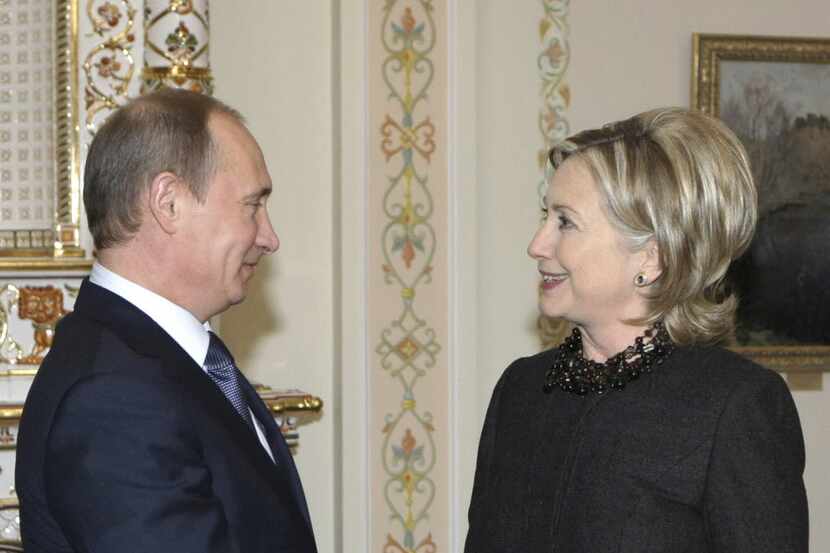 Russian Prime Minister Vladimir Putin greeted Secretary of State Hillary Clinton during a...