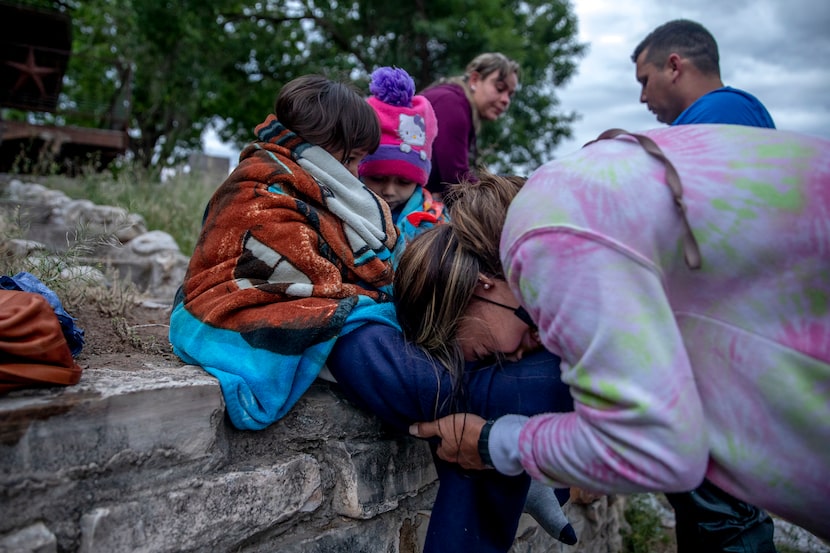 Johenny Sanchez breaks down after crossing the Rio Grande near Del Rio on Friday, April 30,...