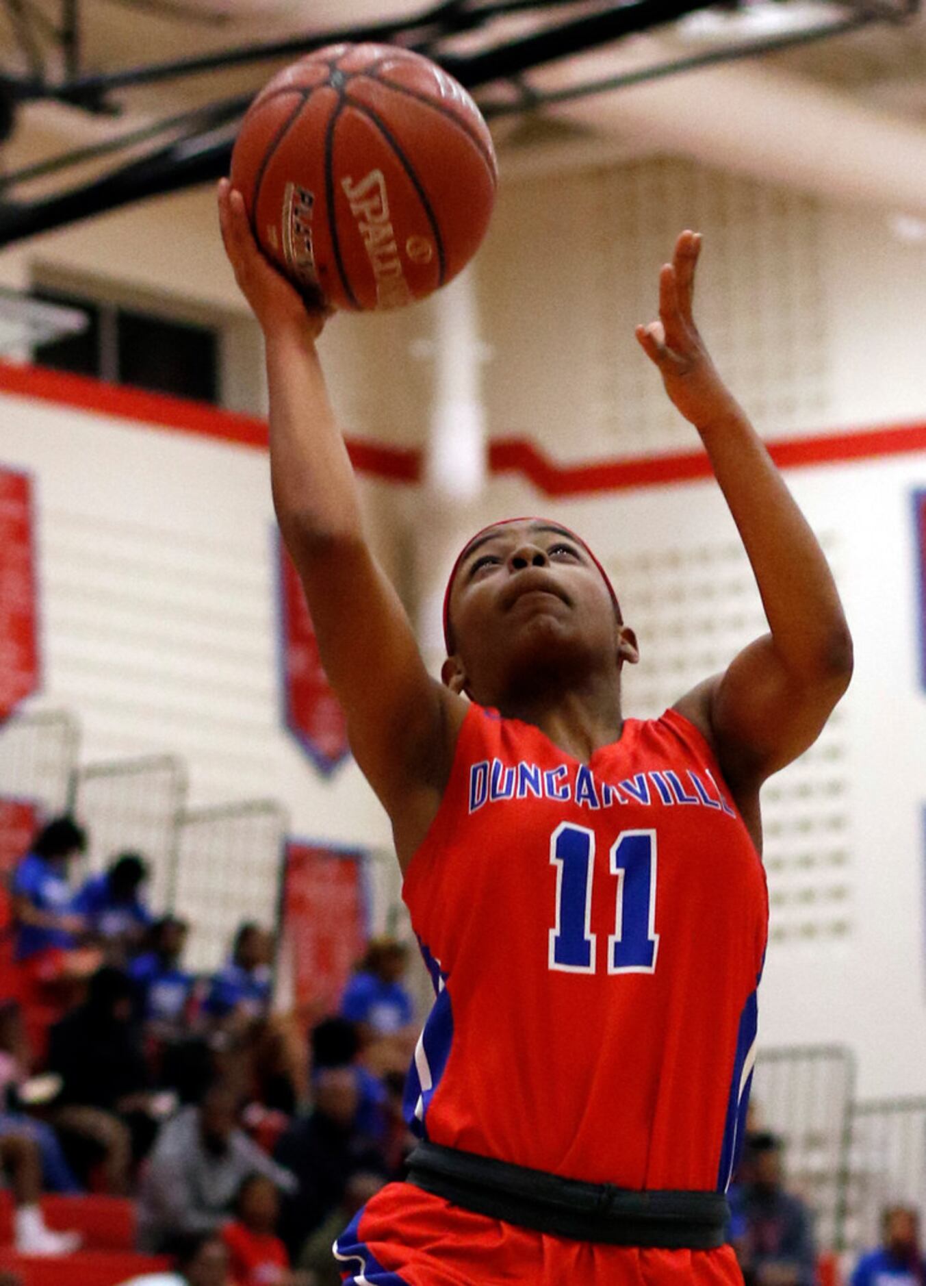 Duncanville's Tristen Taylor (11) scores on a fast break during first half action against...