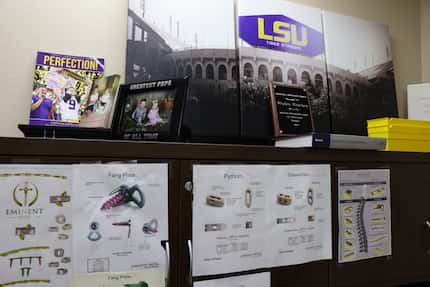 Courtney’s office surroundings include medical devices and memorabilia from Louisiana State...