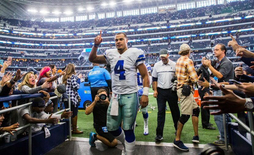 Dallas Cowboys quarterback Dak Prescott (4) leaves the field after a 27-17 win over the...