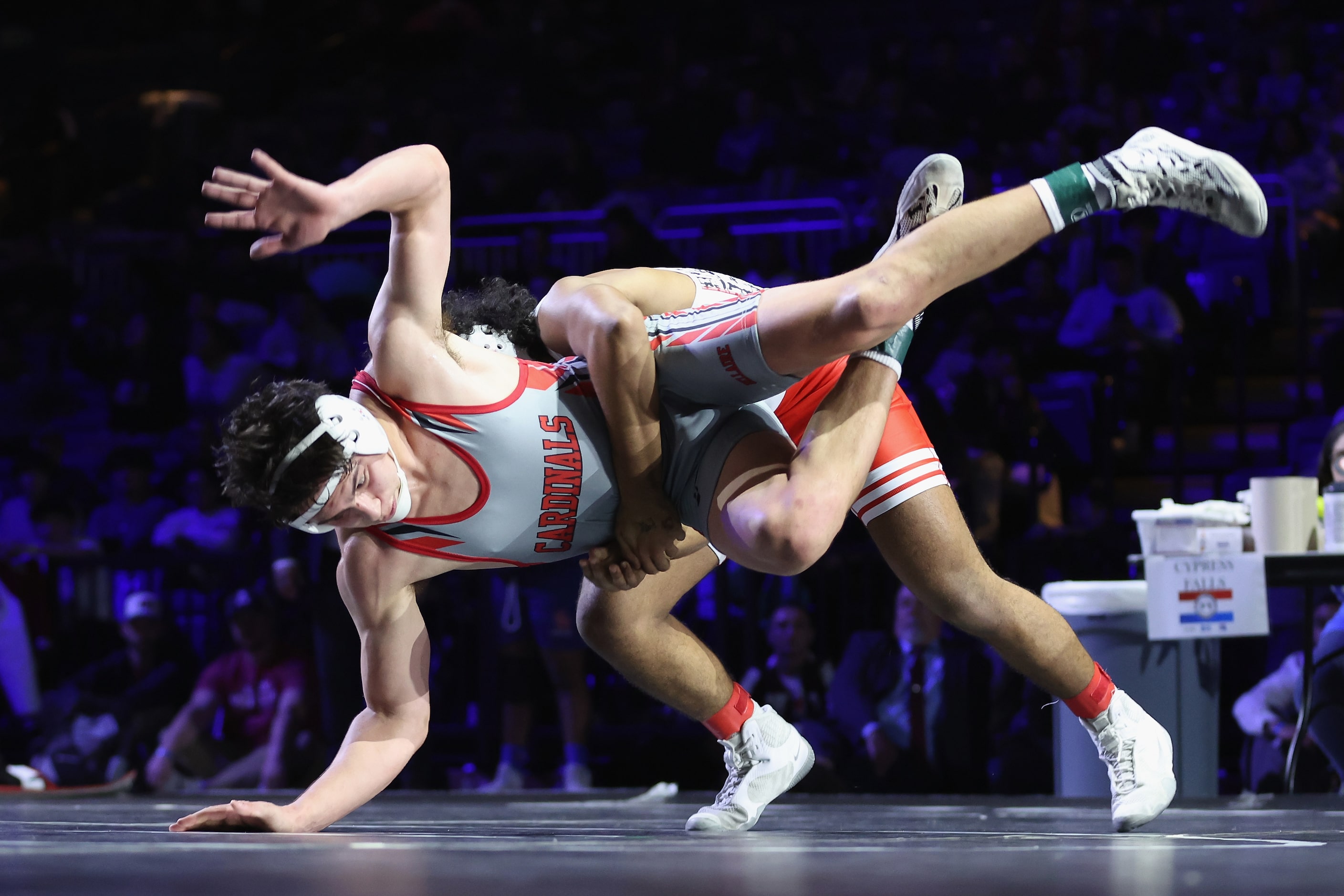 Ibraheem Ahmed of Arlington Martin (red) competes against Rocco Grazier of Houston Bellaire...