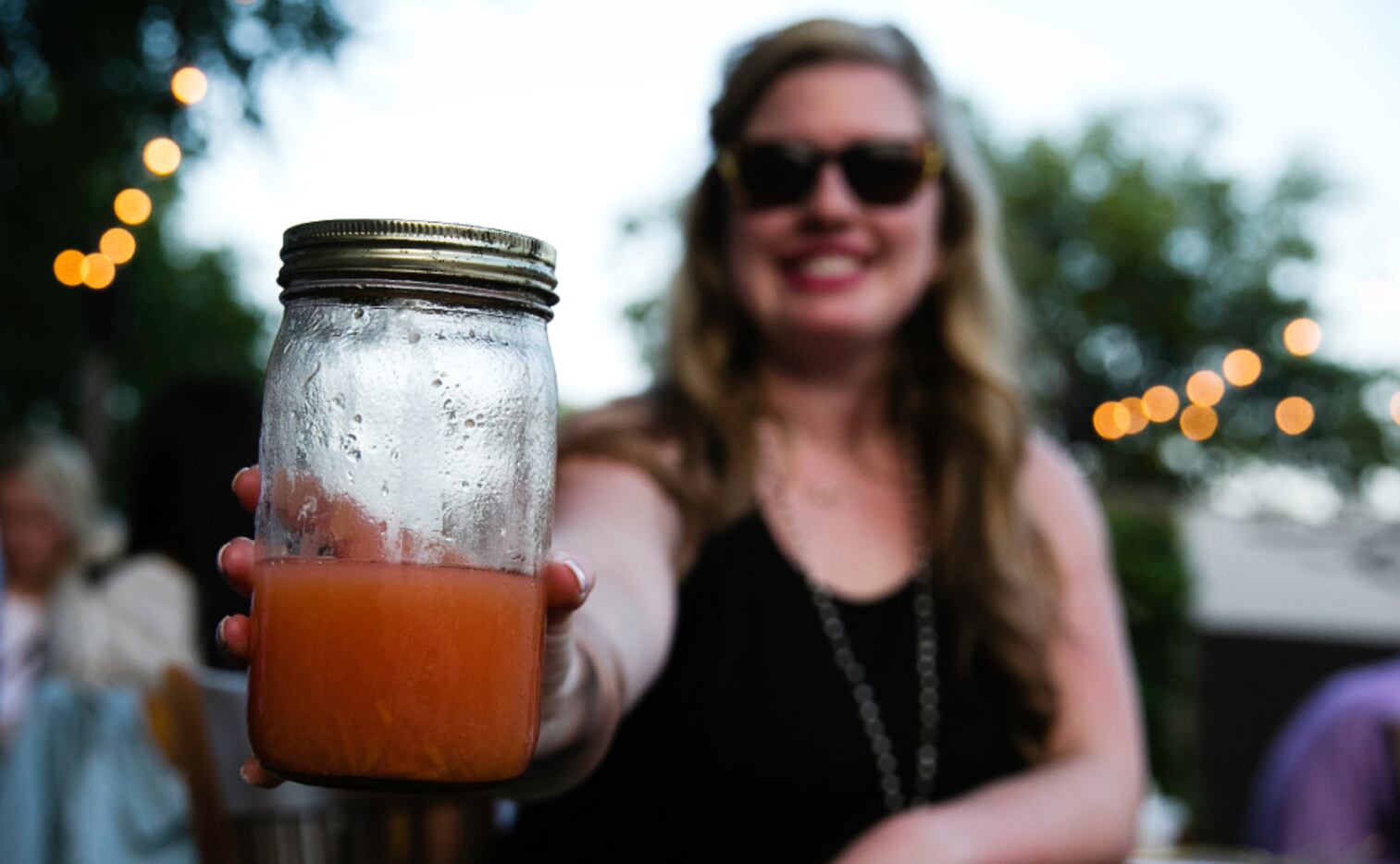 Calie Salls brings a mixed drink during the supper club dinner at Magdalena's in June. It...