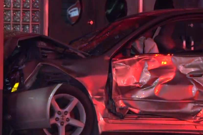 A Nissan Altima was heavily damaged after it crashed into a van and then into a brick wall...