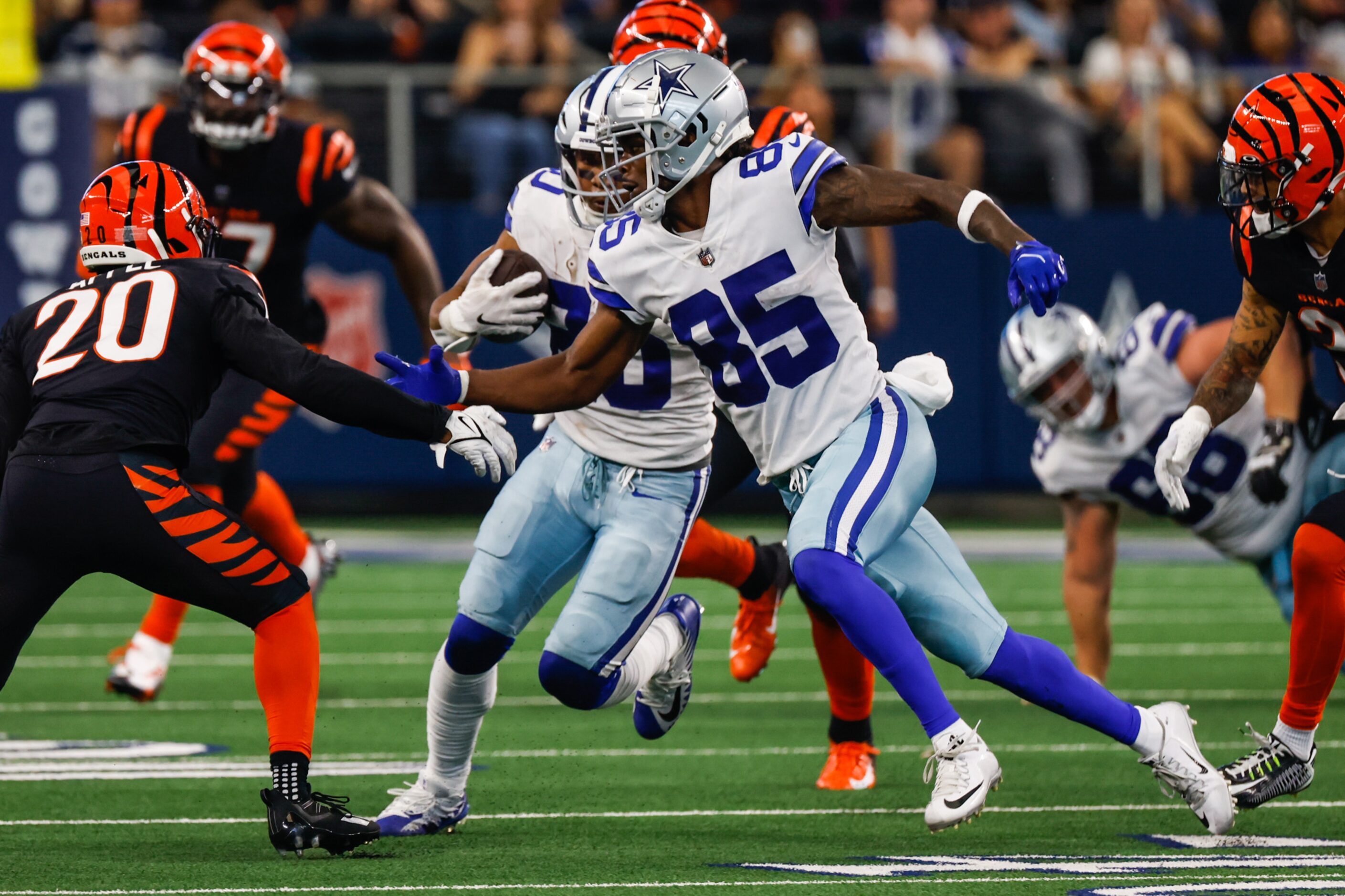 Dallas Cowboys wide receiver Noah Brown (85) protects running back Tony Pollard (20) as he...