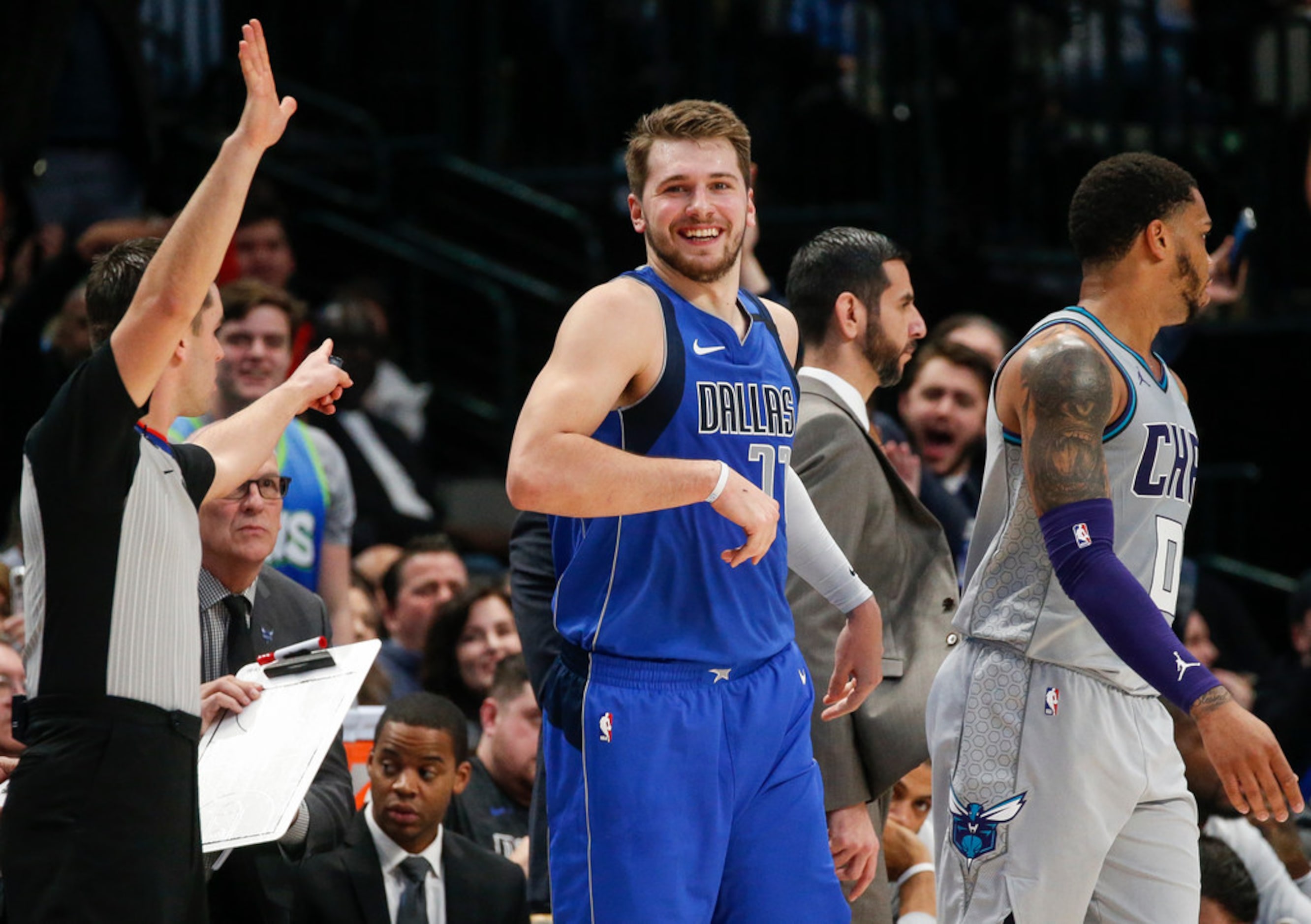 Dallas Mavericks forward Luka Doncic (77) celebrates scoring during the second half of a NBA...