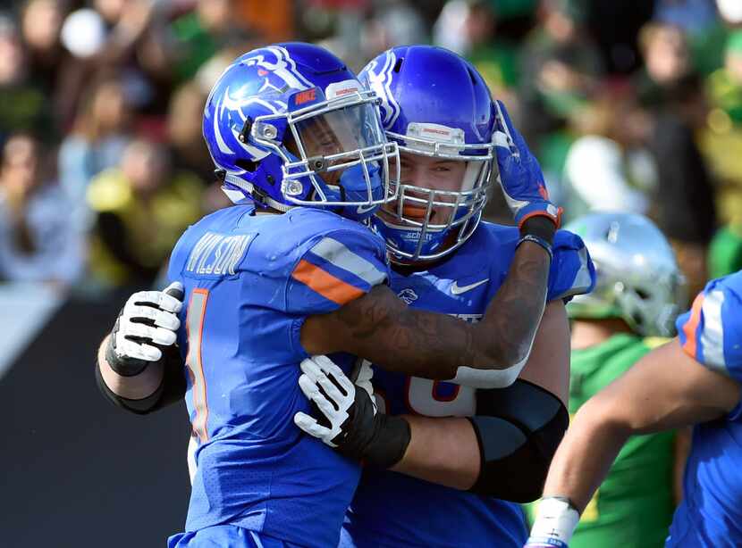 LAS VEGAS, NV - DECEMBER 16:  Cedrick Wilson #1 and Mason Hampton #59 of the Boise State...