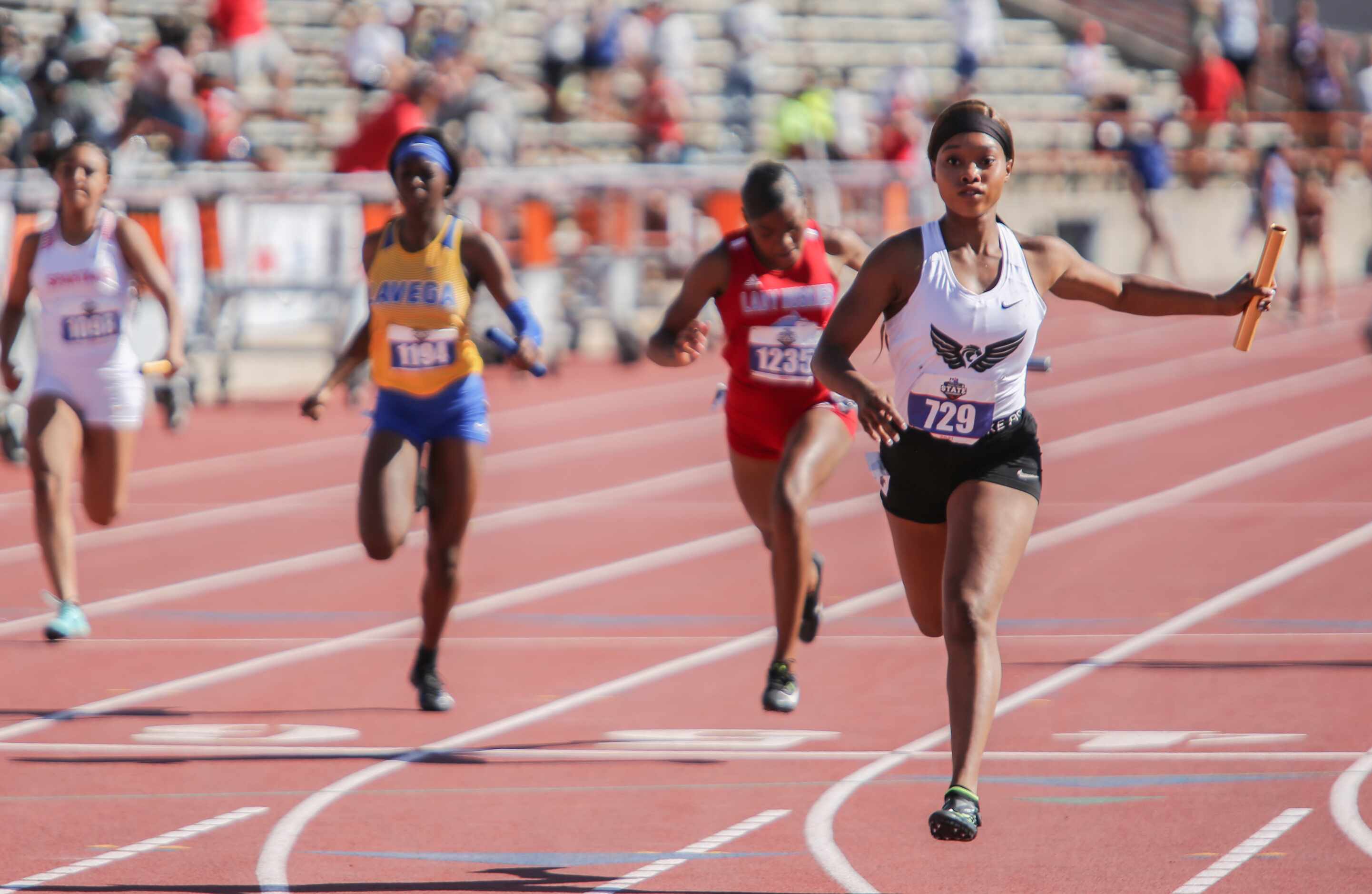 Kennedale's Brianna Brand crosses the finish line during their 4A girls 4x100 relay at the...
