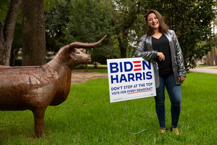 Luisa F. Hernandez, 25, with the Biden/Harris sign outside her home in Coppell.