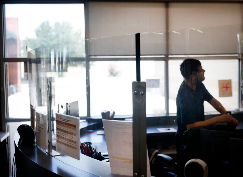 Safety glass creates a barrier between the public and the front desk at Cimarron Park...