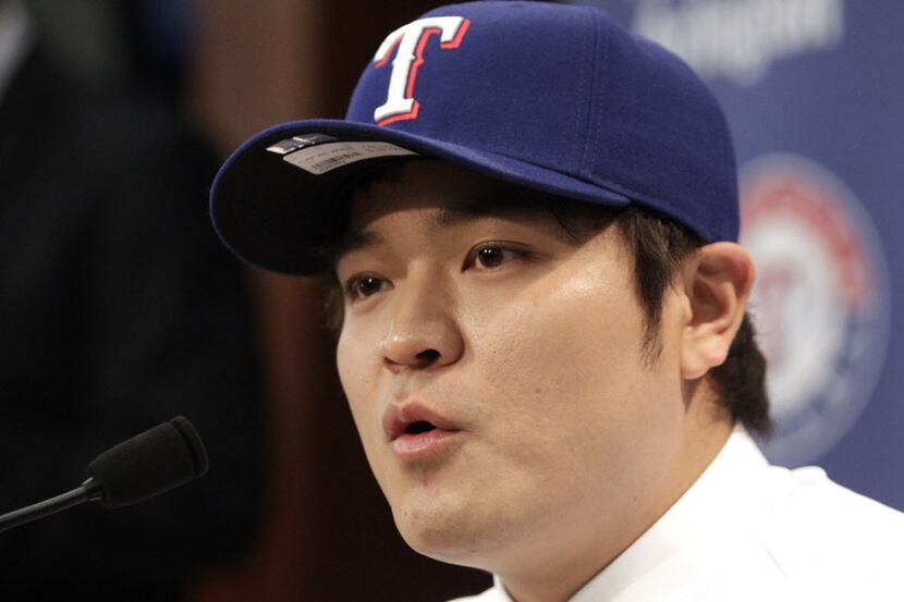Shin-Soo Choo of South Korea answers questions during a news conference announcing his...