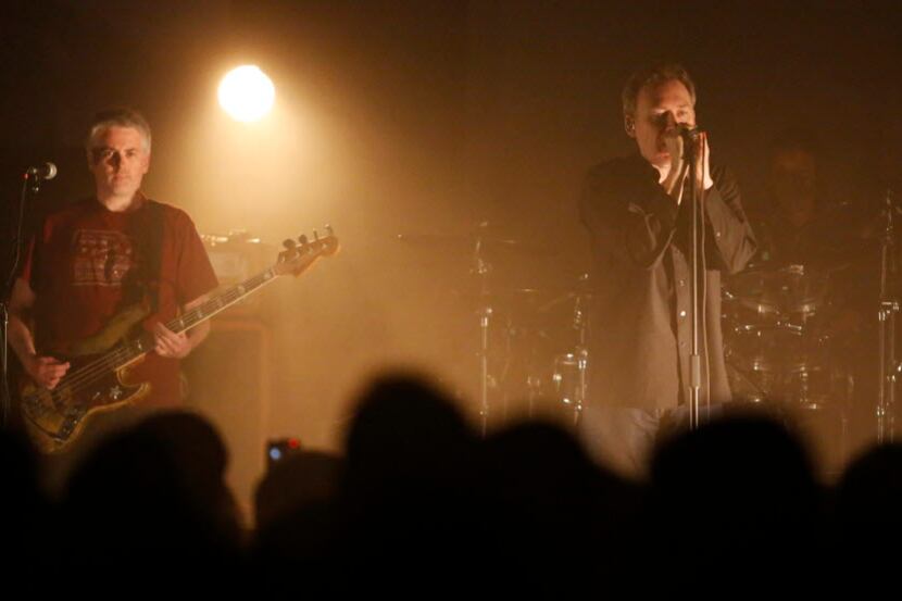 Bass player Mark Crozer, left, and lead singer Jim Reid, right, of The Jesus & Mary Chain,...