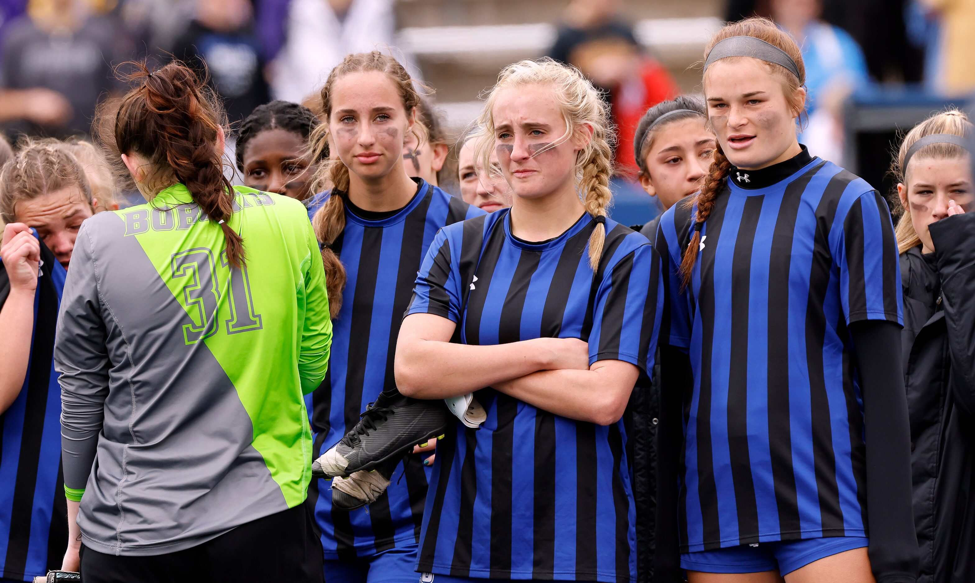 Trophy Club Byron Nelson soccer players watch as Flower Mound Marcus celebrates their Class...