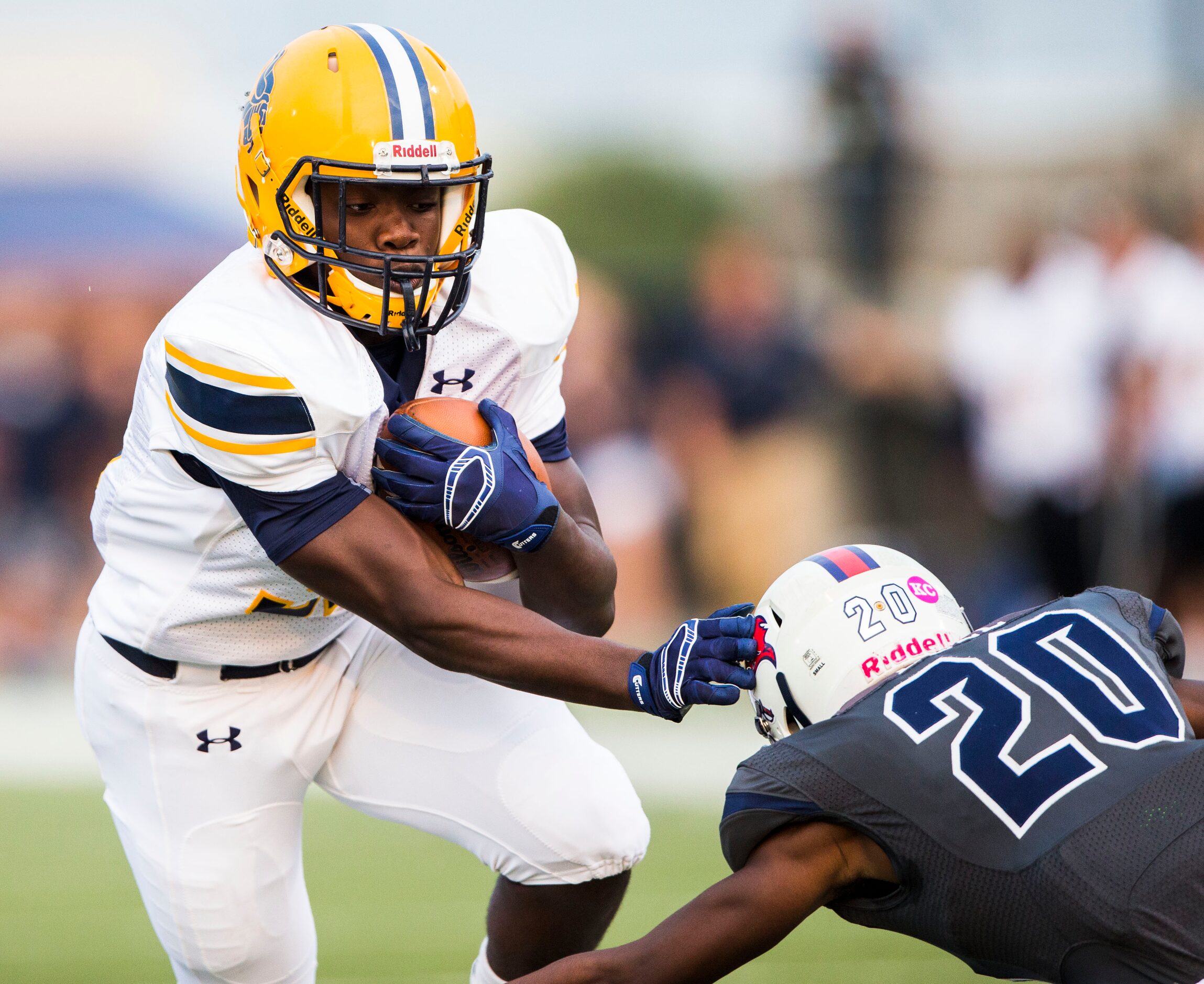 Lamar High School running back Rashod Polk (32) is tackled by Richland High School's Darrion...