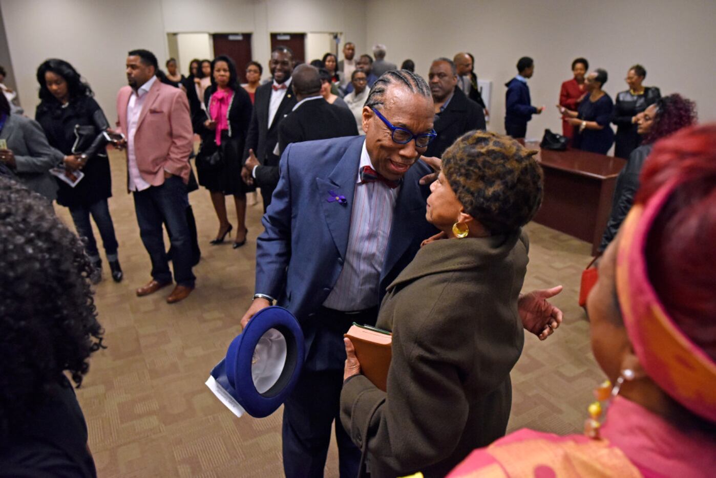 Dallas County Commissioner John Wiley Price greets longtime friend Diane Miles after a...