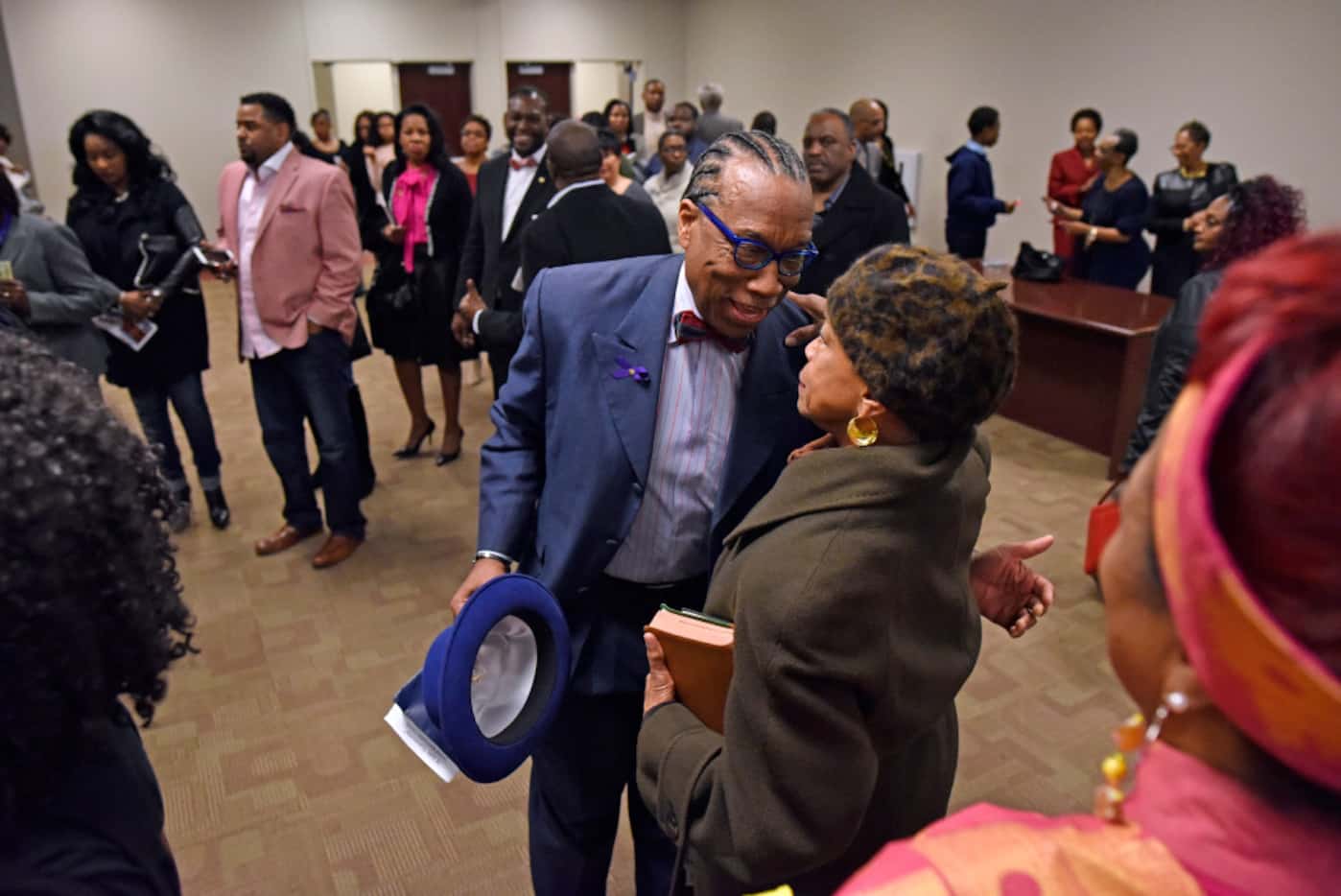 Dallas County Commissioner John Wiley Price greets longtime friend Diane Miles after a...