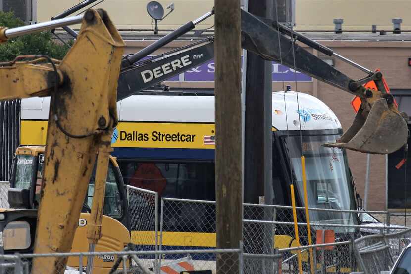 The Dallas streetcar is seen through a maze of construction at the Bishop Arts stop on April...