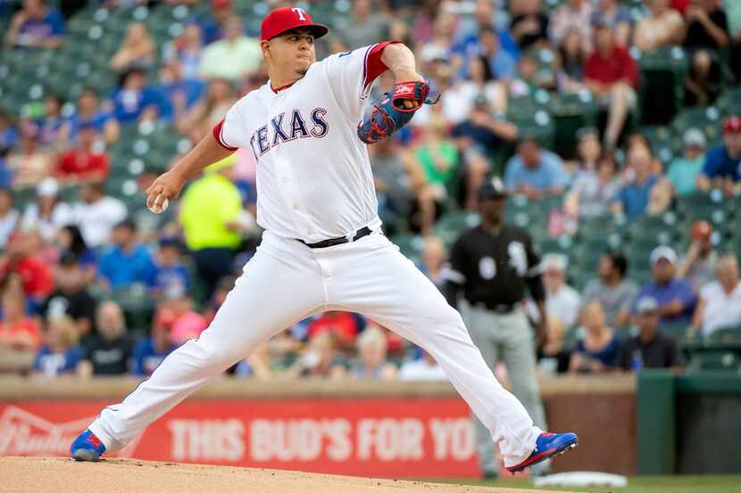 Texas Rangers starting pitcher Ariel Jurado works against the Chicago White Sox during the...