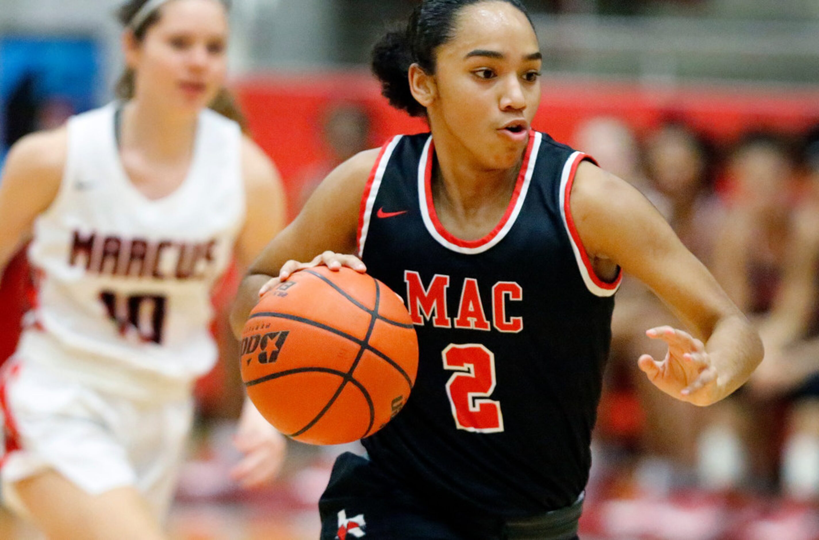 Irving MacArthur High School guard Jordyn Newsome (2) brings the ball down the court on a...